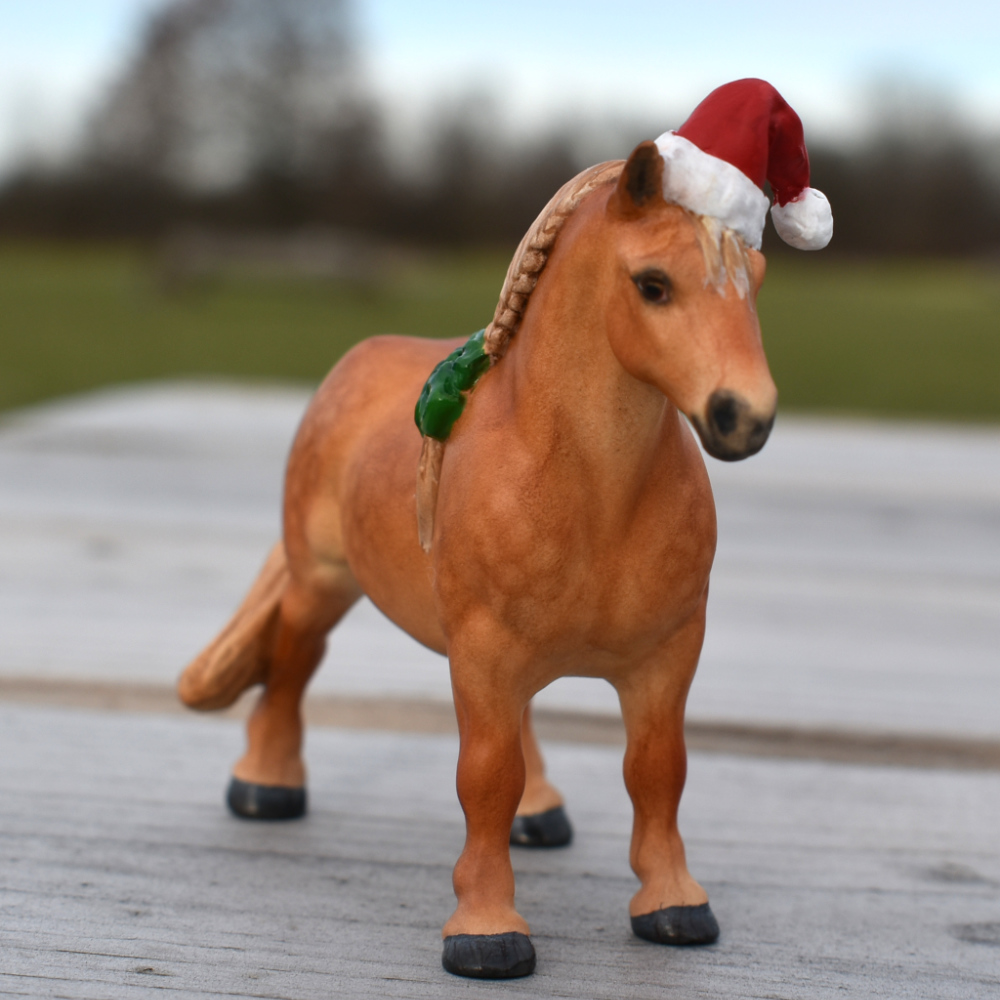 Festive Suffolk punch mare with santa hat and green bows in dapple chestnut Model horse (Breyer Stablemate) mare by Sarah Tregay